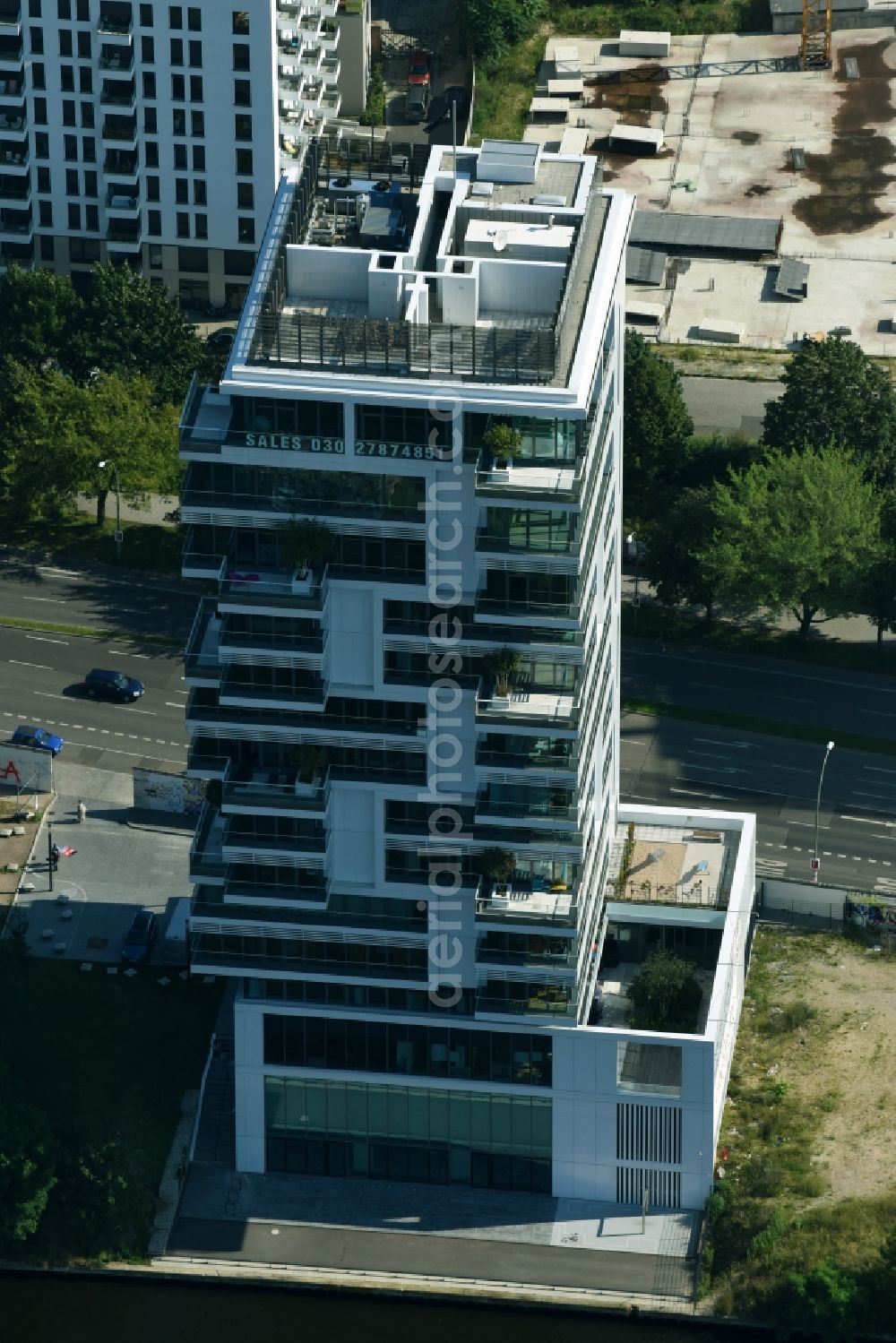 Berlin from above - Project Living Levels at Muhlenstrasse on the banks of the River Spree in Berlin - Friedrichshain. On the grounds of the Berlin Wall border strip at the EastSideGallery, the company Living Bauhaus is building a futuristic high-rise residential. The real estate service company City & Home GmbH manages the available apartments