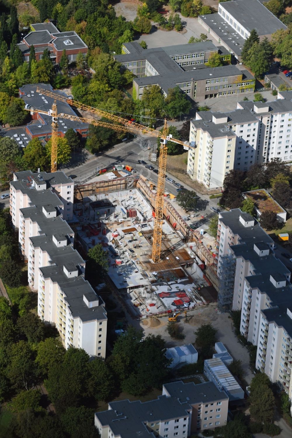 Aerial photograph Berlin - High-rise construction site for a new residential and commercial building Theodor-Loos-Weg corner Wutzkyallee in the district Buckow in Berlin, Germany