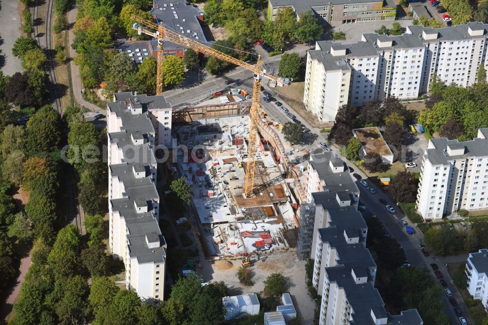 Berlin from the bird's eye view: High-rise construction site for a new residential and commercial building Theodor-Loos-Weg corner Wutzkyallee in the district Buckow in Berlin, Germany