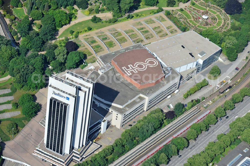 Hamburg from above - View of the tower of the Radisson Blu Hotel Hamburg. It lies with the Congress Center Hamburg (CCH) in close proximity to Dammtor station right on the edge of the park Planten un Blomenund with a height of 108 meters, the tallest hotel and the tallest building in the city