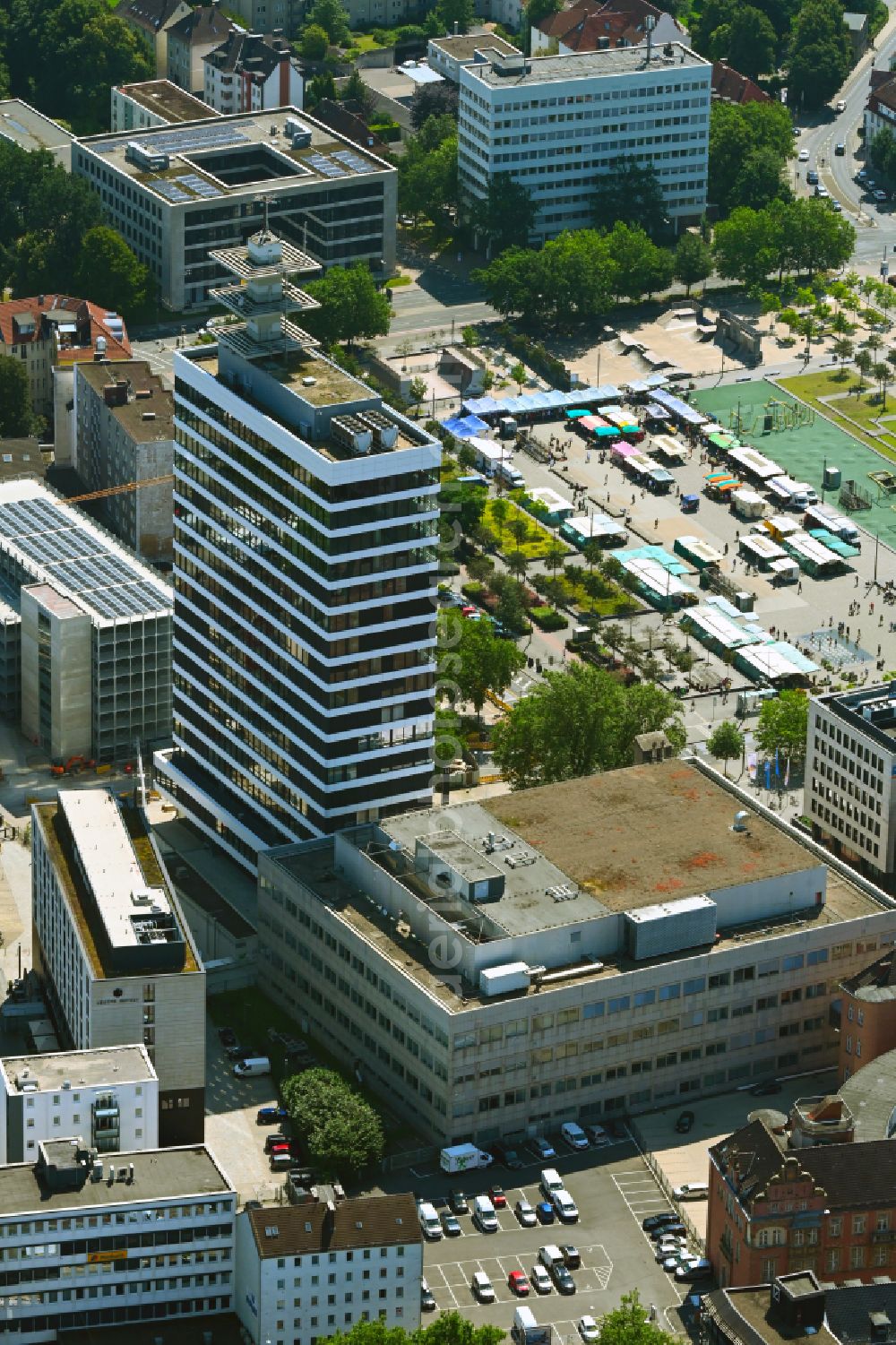 Bielefeld from the bird's eye view: Construction site for the conversion of the office building and commercial building high-rise complex H 1 (formerly: Telekom high-rise and telecommunications high-rise) at Kesselbrink - Philipp-Reis-Platz in the Mitte district of Bielefeld in the federal state of North Rhine-Westphalia, Germany