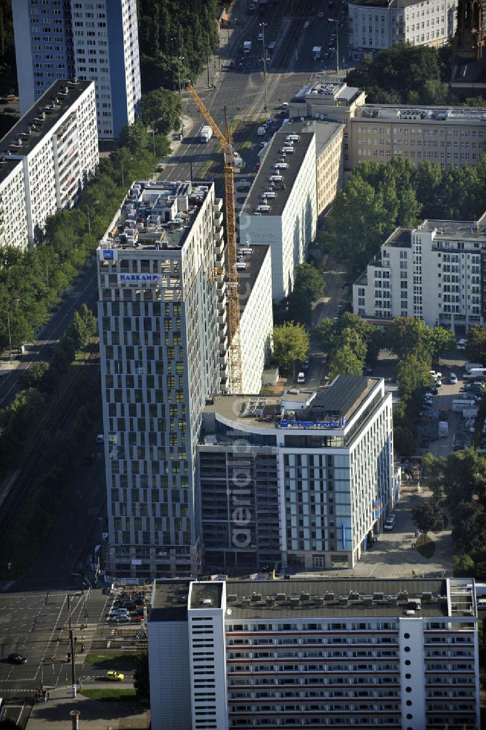 Berlin from the bird's eye view: Blick auf die Hochhaus- Baustelle Mollstraße 31 Ecke Otto-Braun-Straße für das neue Wohn- und Geschäftshaus Königstadt- Carree . Rechts daneben entsteht das neue ETAP Hotel. View of the high-rise construction on the corner of Otto-Braun-Strasse for the new residential and commercial building. To the right stands the new ETAP hotel.