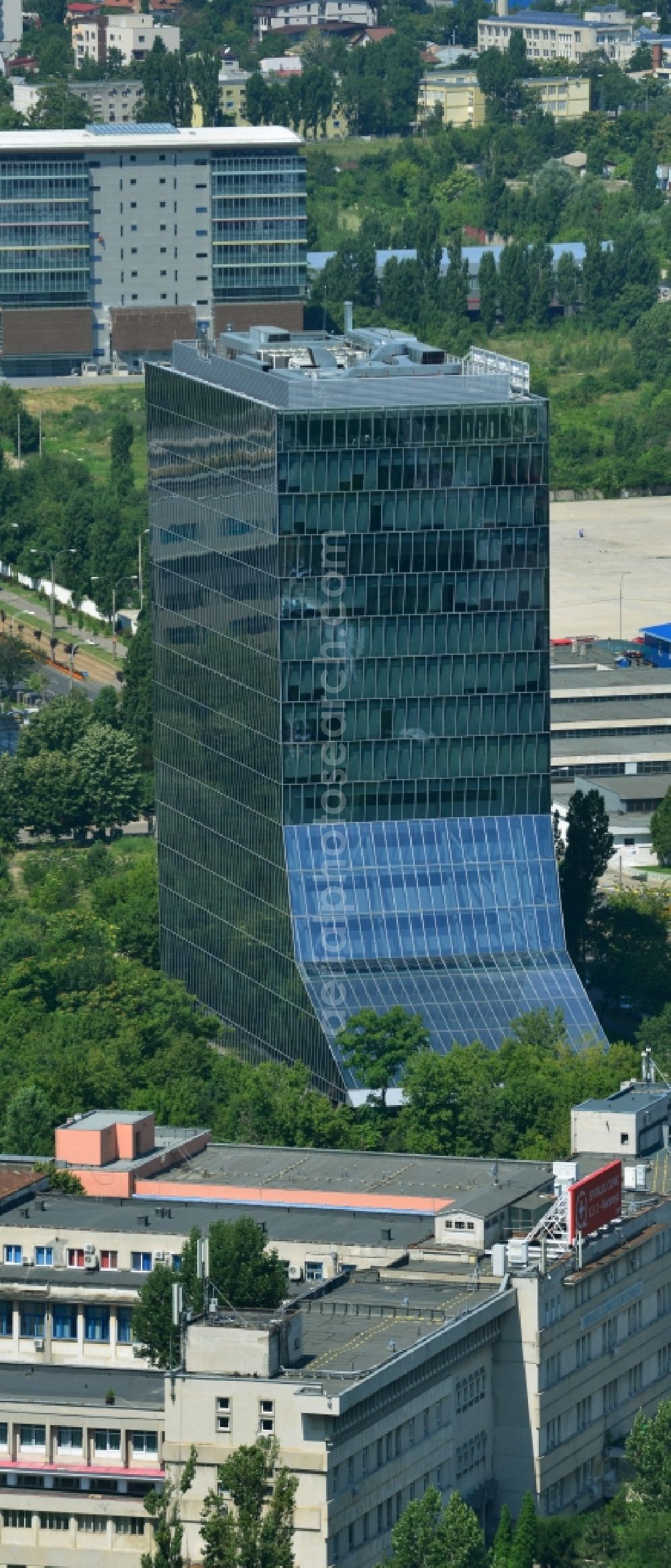 Aerial image Bukarest - High-rise building of UniCredit Bank ?iriac (Sediul central) on Bulevardul Expozitiei in Bucharest in Romania