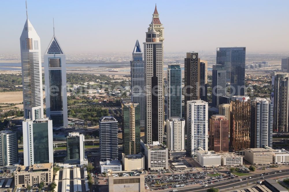 Dubai from the bird's eye view: Explosively is the city of Dubai in the United Arab Emirates growing. Countless swanky skyscrapers are under construction and will change the cityscape and skyline to the EXPO 2020. Here the Skyscrapers around the Emerates Towers