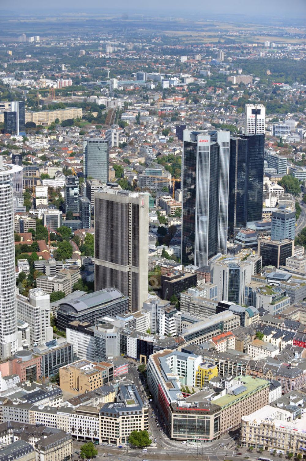 FRANKFURT AM MAIN from the bird's eye view: The Westend Tower is a skyscraper and hosts the central control of the DZ Bank. The skyscraper Frankfurter Büro Center mainly hosts the law firm Clifford Chance. The central control of the DeKaBank is located in the skyscraper Trianon. The two twin towers of the skyscraper Deutsche-Bank-Hochhaus