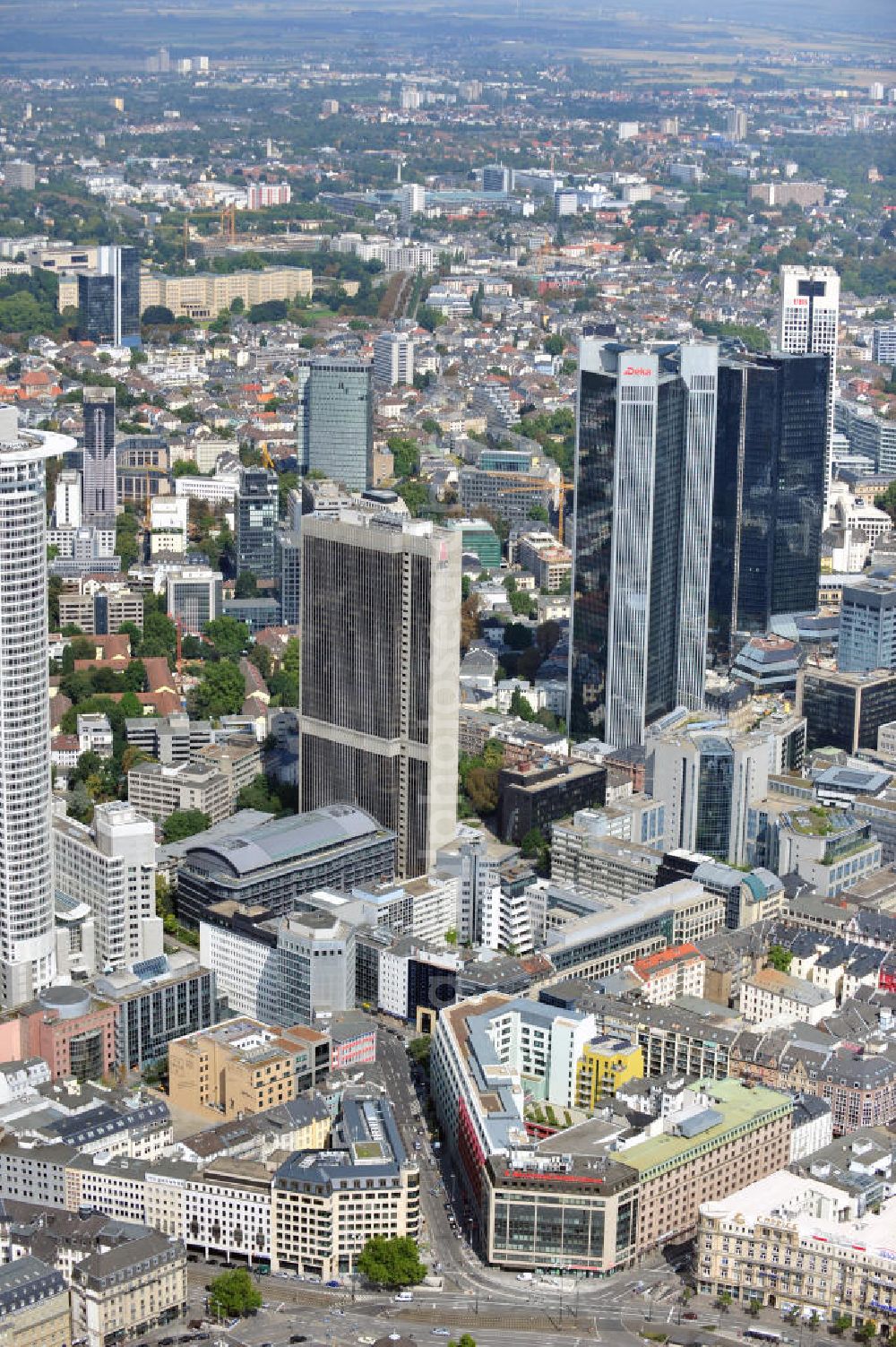 Aerial image FRANKFURT AM MAIN - The Westend Tower is a skyscraper and hosts the central control of the DZ Bank. The skyscraper Frankfurter Büro Center mainly hosts the law firm Clifford Chance. The central control of the DeKaBank is located in the skyscraper Trianon. The two twin towers of the skyscraper Deutsche-Bank-Hochhaus