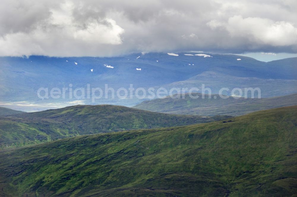 Aerial image Fort Williams - Mountains of the Scottish Highlands with the snow-capped mountain Ben Nevis in United Kingdom