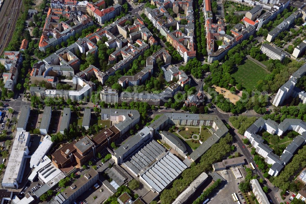 Berlin from above - The Grand Master Church is located at Hochmeisterplatz in the district of Wilmersdorf of Berlin. The Protestant brick church was built in the Romanesque Revival style, designed by the architect Otto Snug. In the residential area around the Hochmeisterplatz at the intersection Westphalian road - Paulsbronner road with premium residential and commercial buildings