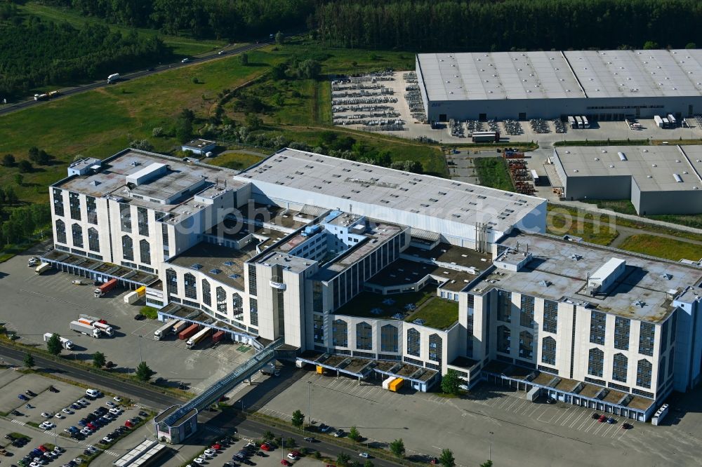 Falkensee from above - High-bay warehouse building complex and logistics center on the premises of eCom Logistik GmbH on Str. of Einheit in Falkensee in the state Brandenburg, Germany