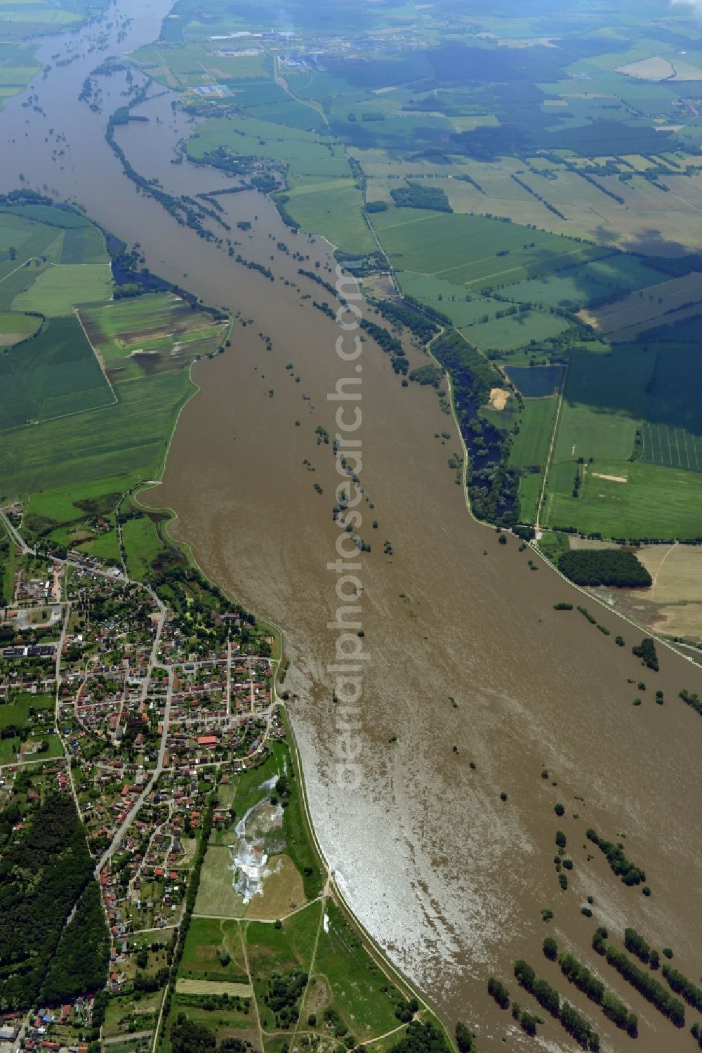 Sandau from the bird's eye view: Flood level - situation from flooding and overflow of the banks of the Elbe along the Lower course at Sandau (Elbe) in Saxony-Anhalt