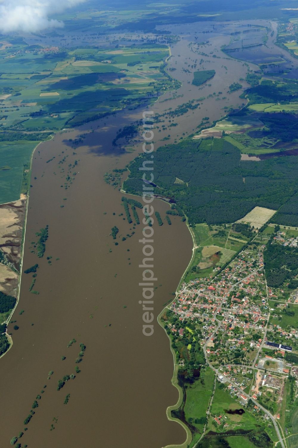 Sandau from the bird's eye view: Flood level - situation from flooding and overflow of the banks of the Elbe along the Lower course at Sandau (Elbe) in Saxony-Anhalt