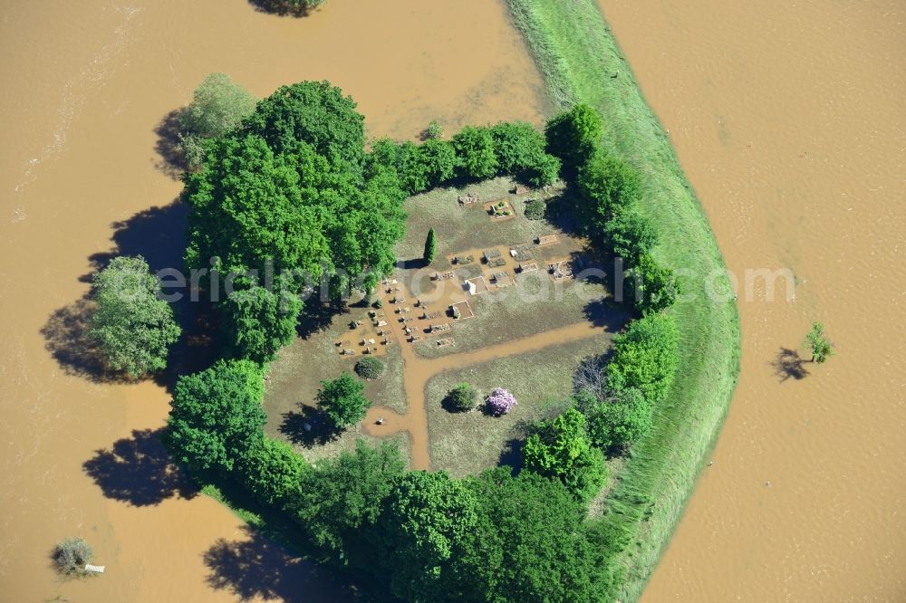 Gruna from the bird's eye view: Flood level - situation from flooding and overflow of the bank of the Mulde in Gruna inSaxony