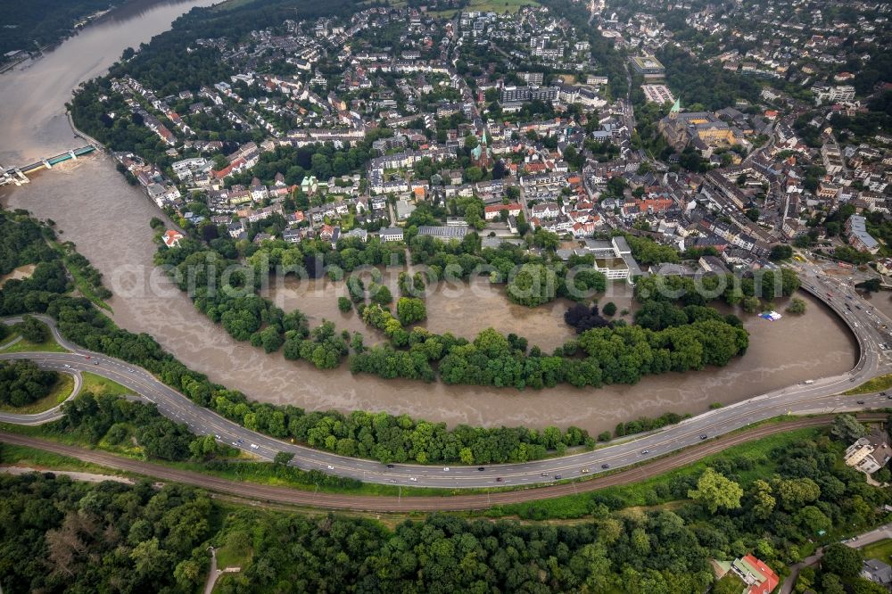 Essen from the bird's eye view: Flood situation and flooding, all-rousing and infrastructure-destroying masses of brown water on the banks of the Ruhr in the district Werden in Essen at Ruhrgebiet in the state North Rhine-Westphalia, Germany