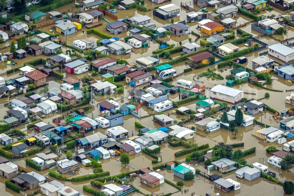 Hagen from the bird's eye view: Flood situation and flooding, all-rousing and infrastructure-destroying masses of brown water on the campsite in the district Westhofen in Hagen at Ruhrgebiet in the state North Rhine-Westphalia, Germany