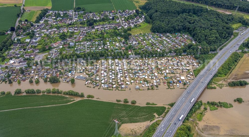 Aerial photograph Hagen - Flood situation and flooding, all-rousing and infrastructure-destroying masses of brown water on the campsite in the district Westhofen in Hagen at Ruhrgebiet in the state North Rhine-Westphalia, Germany