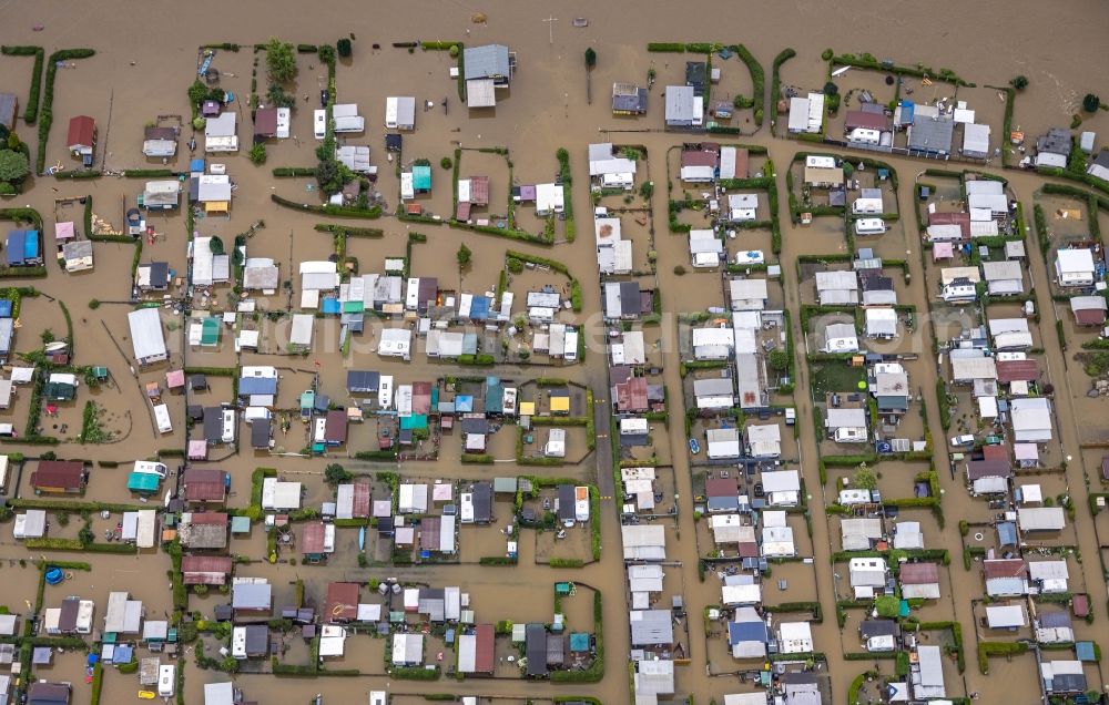 Hagen from the bird's eye view: Flood situation and flooding, all-rousing and infrastructure-destroying masses of brown water on the campsite in the district Westhofen in Hagen at Ruhrgebiet in the state North Rhine-Westphalia, Germany