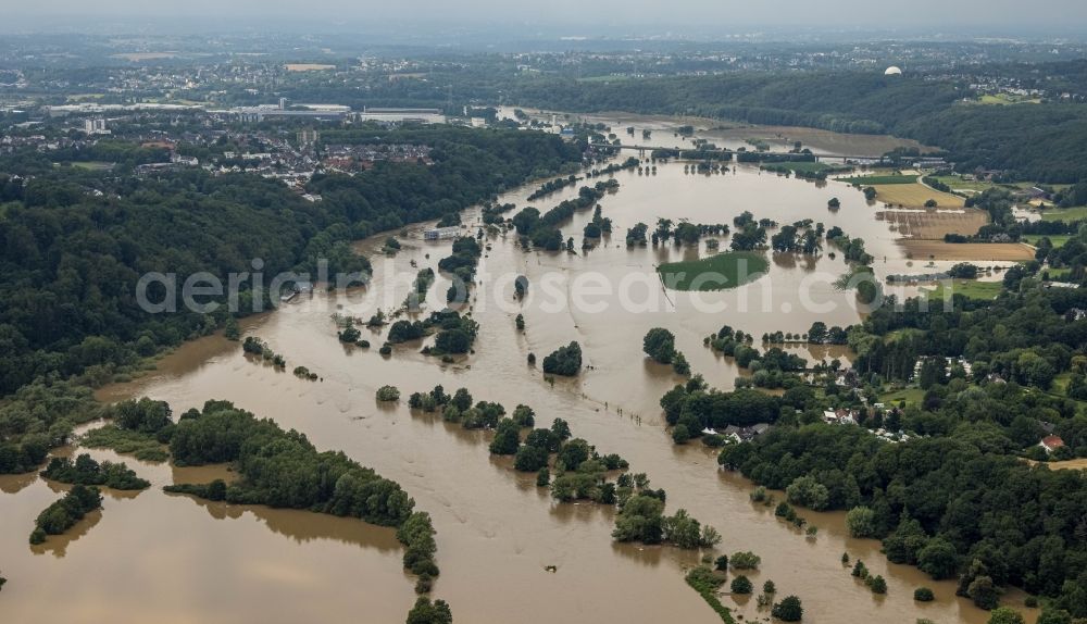 Hattingen from the bird's eye view: Flood situation and flooding, all-rousing and infrastructure-destroying masses of brown water along the trampled Ruhr - river course in Hattingen at Ruhrgebiet in the state North Rhine-Westphalia, Germany