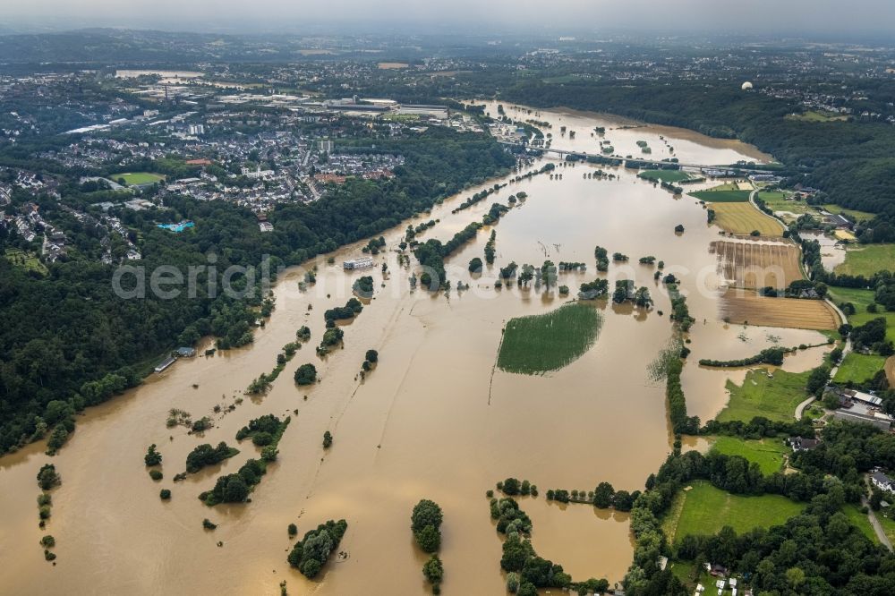 Hattingen from the bird's eye view: Flood situation and flooding, all-rousing and infrastructure-destroying masses of brown water along the trampled Ruhr - river course in Hattingen at Ruhrgebiet in the state North Rhine-Westphalia, Germany