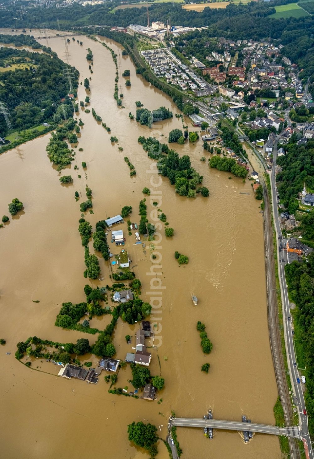 Aerial photograph Bochum - Flood situation and flooding, all-rousing and infrastructure-destroying masses of brown water along the Ruhr in the district Dahlhausen in Bochum at Ruhrgebiet in the state North Rhine-Westphalia, Germany