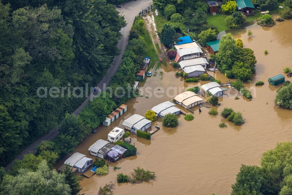 Hattingen from the bird's eye view: Flood situation and flooding, all-rousing and infrastructure-destroying masses of brown water along the Ruhr in Hattingen at Ruhrgebiet in the state North Rhine-Westphalia, Germany