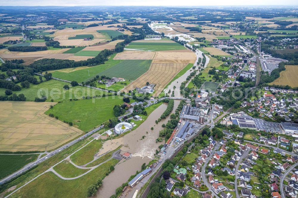 Aerial photograph Langschede - Flood situation and flooding, all-rousing and infrastructure-destroying masses of brown water along the Ruhr in Langschede in the state North Rhine-Westphalia, Germany