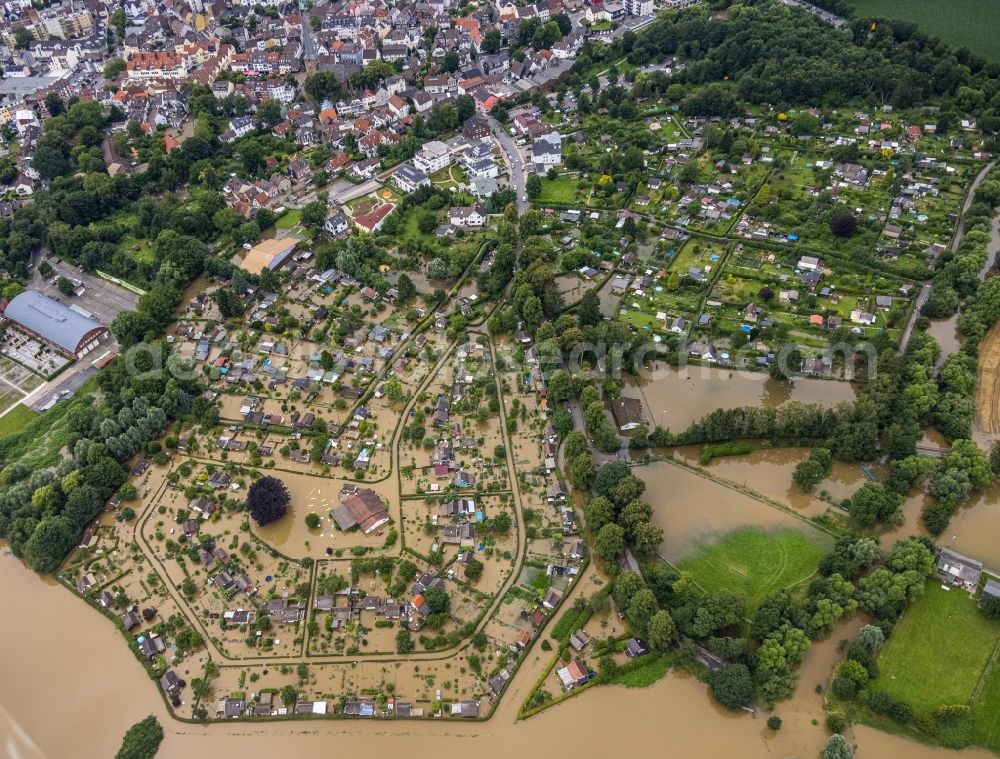 Aerial image Schwerte - Flood situation and flooding, all-rousing and infrastructure-destroying masses of brown water along the Ruhr in Schwerte in the state North Rhine-Westphalia, Germany