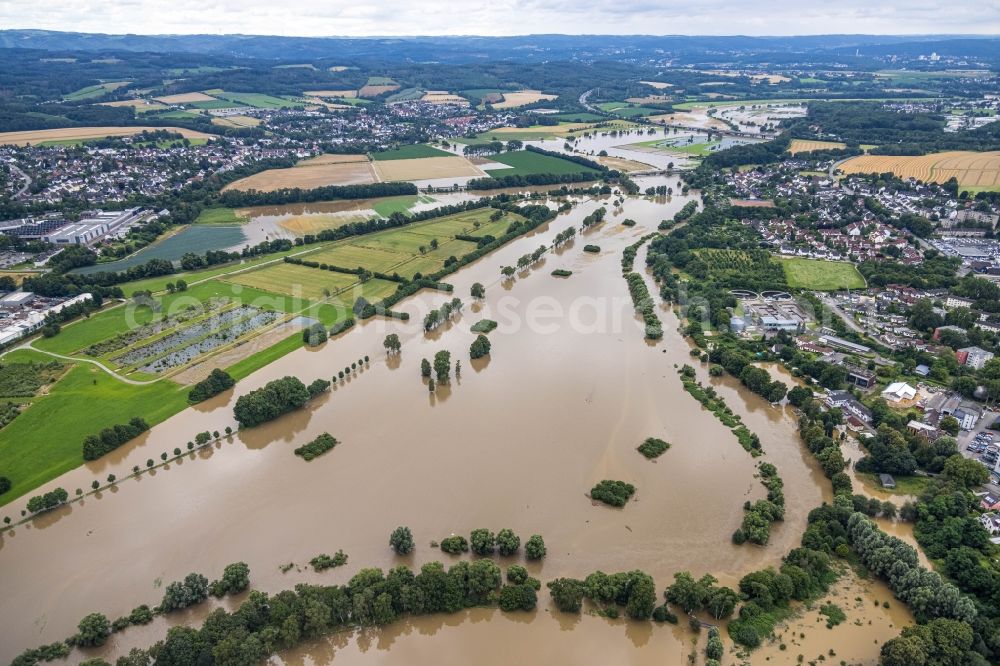 Aerial photograph Schwerte - Flood situation and flooding, all-rousing and infrastructure-destroying masses of brown water along the Ruhr in Schwerte in the state North Rhine-Westphalia, Germany