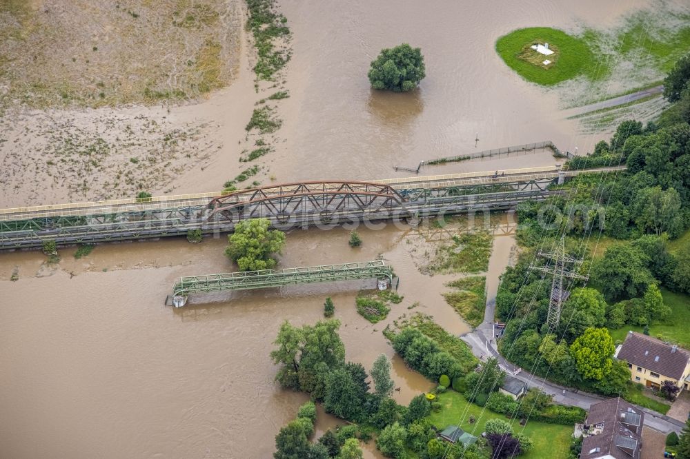 Aerial image Schwerte - Flood situation and flooding, all-rousing and infrastructure-destroying masses of brown water along the Ruhr in Schwerte in the state North Rhine-Westphalia, Germany