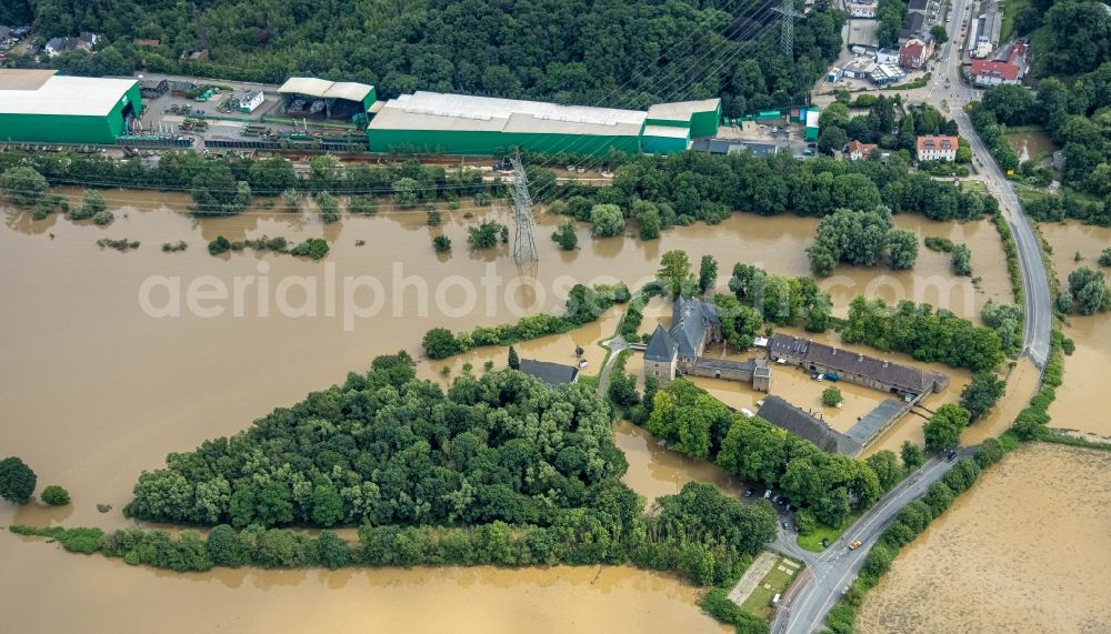 Hattingen from above - Flood situation and flooding, all-rousing and infrastructure-destroying masses of brown water at the fortress of the castle Haus Kemnade An der Kemnade in Hattingen at Ruhrgebiet in the state North Rhine-Westphalia, Germany