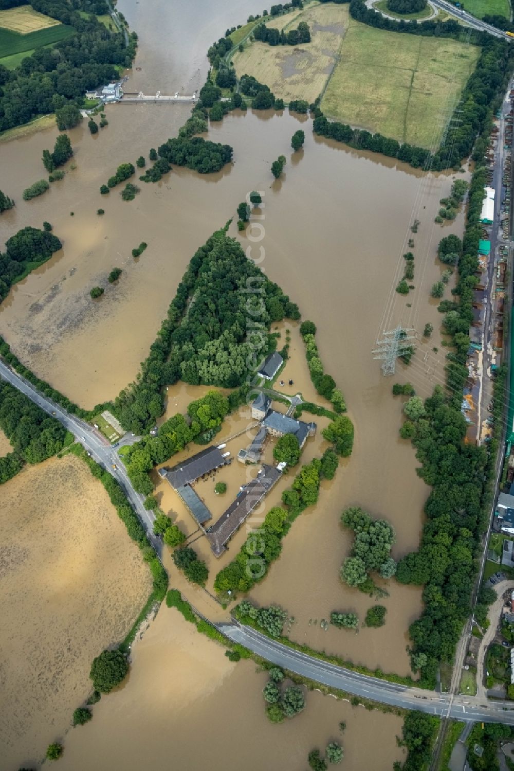 Aerial image Hattingen - Flood situation and flooding, all-rousing and infrastructure-destroying masses of brown water at the fortress of the castle Haus Kemnade An der Kemnade in Hattingen at Ruhrgebiet in the state North Rhine-Westphalia, Germany