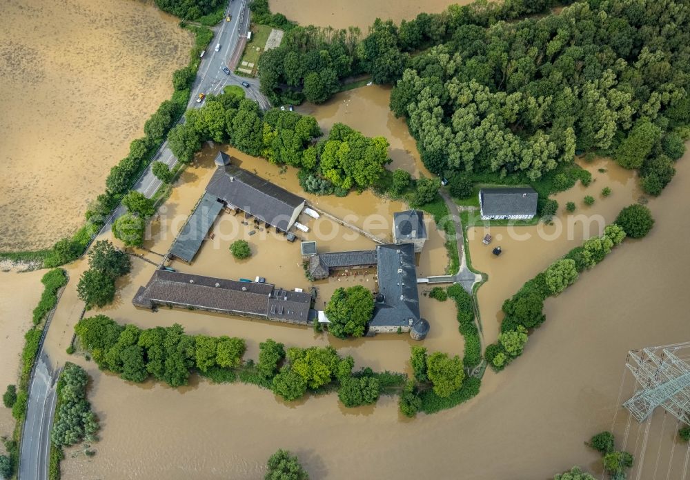 Aerial photograph Hattingen - Flood situation and flooding, all-rousing and infrastructure-destroying masses of brown water at the fortress of the castle Haus Kemnade An der Kemnade in Hattingen at Ruhrgebiet in the state North Rhine-Westphalia, Germany