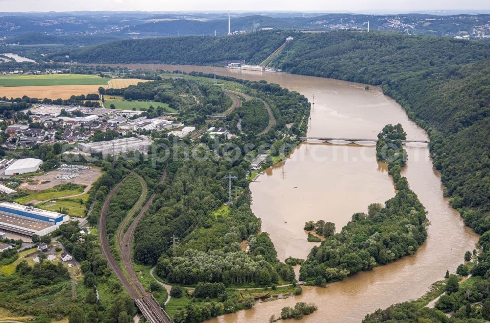 Hagen from the bird's eye view: Flood situation and flooding, all-rousing and infrastructure-destroying masses of brown water on the course of the river Lenne in Hagen at Ruhrgebiet in the state North Rhine-Westphalia, Germany