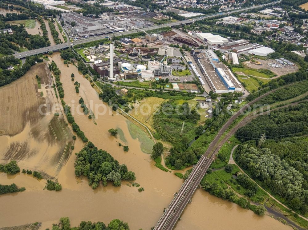 Aerial photograph Hagen - Flood situation and flooding, all-rousing and infrastructure-destroying masses of brown water on the course of the river Lenne in Hagen at Ruhrgebiet in the state North Rhine-Westphalia, Germany