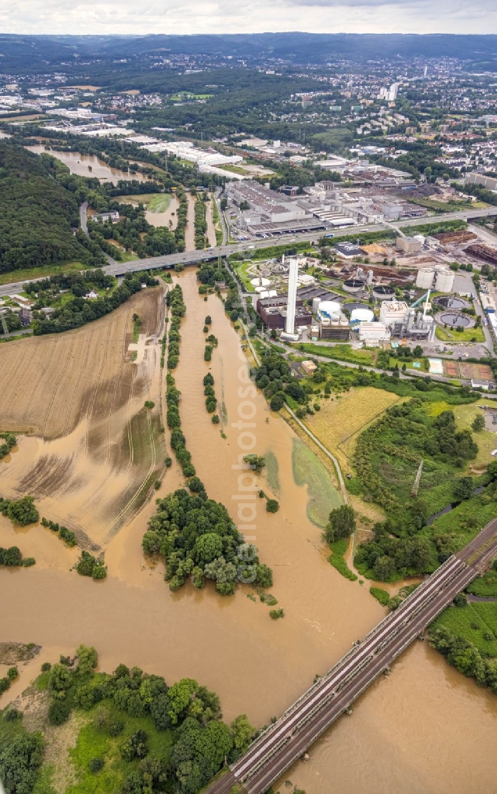 Hagen from above - Flood situation and flooding, all-rousing and infrastructure-destroying masses of brown water on the course of the river Lenne in Hagen at Ruhrgebiet in the state North Rhine-Westphalia, Germany