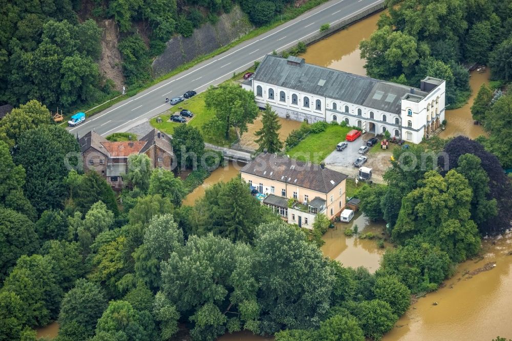 Aerial image Hagen - Flood situation and flooding, all-rousing and infrastructure-destroying masses of brown water on the course of the river Lenne in Hagen at Ruhrgebiet in the state North Rhine-Westphalia, Germany