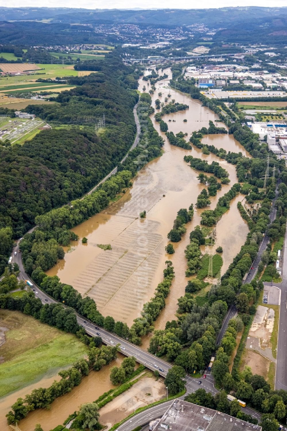 Hagen from above - Flood situation and flooding, all-rousing and infrastructure-destroying masses of brown water on the course of the river Lenne in Hagen at Ruhrgebiet in the state North Rhine-Westphalia, Germany