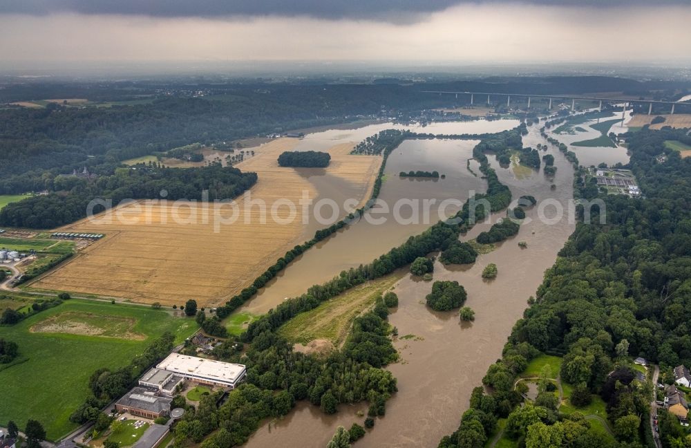 Essen from above - Flood situation and flooding, all-rousing and infrastructure-destroying masses of brown water on the course of the river Ruhr in the district Kettwig in Essen at Ruhrgebiet in the state North Rhine-Westphalia, Germany