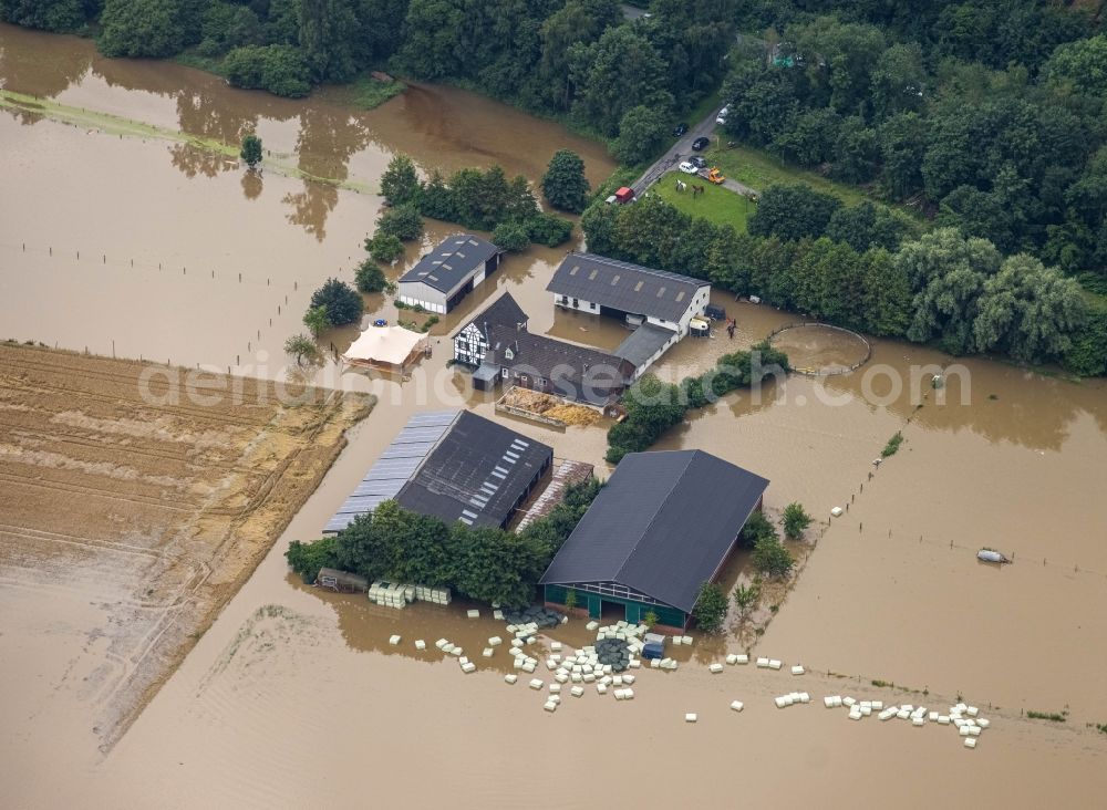 Essen from above - Flood situation and flooding, all-rousing and infrastructure-destroying masses of brown water on the course of the river Ruhr in the district Kettwig in Essen at Ruhrgebiet in the state North Rhine-Westphalia, Germany