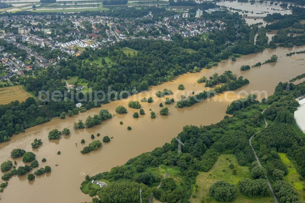 Essen from the bird's eye view: Flood situation and flooding, all-rousing and infrastructure-destroying masses of brown water on the course of the river Ruhr in the district Ueberruhr - Hinsel in Essen at Ruhrgebiet in the state North Rhine-Westphalia, Germany