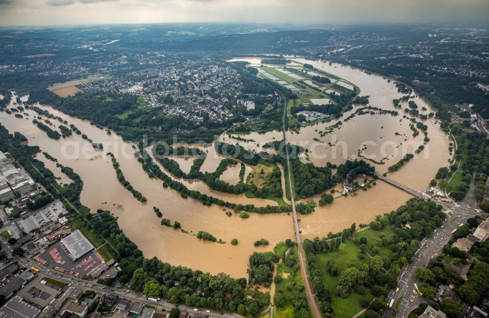 Essen from above - Flood situation and flooding, all-rousing and infrastructure-destroying masses of brown water on the course of the river Ruhr in the district Ueberruhr - Hinsel in Essen at Ruhrgebiet in the state North Rhine-Westphalia, Germany