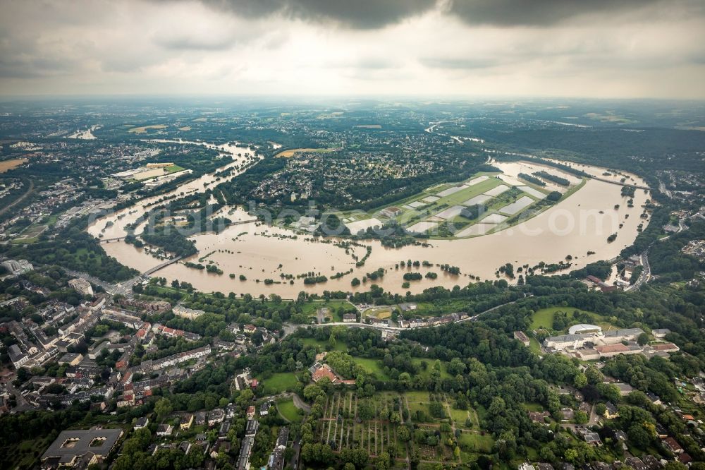 Aerial image Essen - Flood situation and flooding, all-rousing and infrastructure-destroying masses of brown water on the course of the river Ruhr in the district Ueberruhr - Hinsel in Essen at Ruhrgebiet in the state North Rhine-Westphalia, Germany