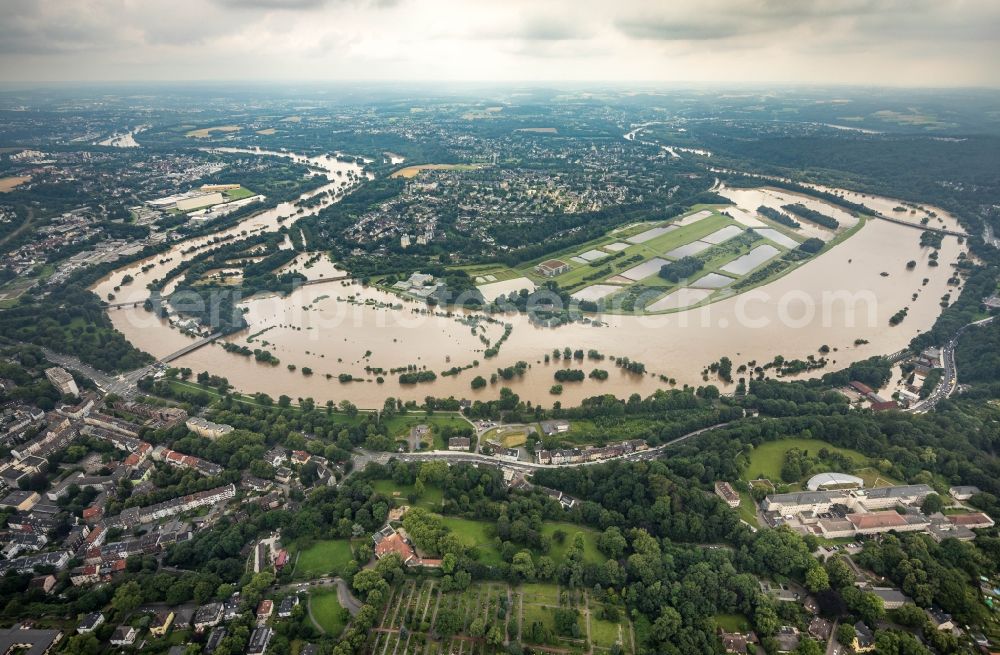 Aerial photograph Essen - Flood situation and flooding, all-rousing and infrastructure-destroying masses of brown water on the course of the river Ruhr in the district Ueberruhr - Hinsel in Essen at Ruhrgebiet in the state North Rhine-Westphalia, Germany