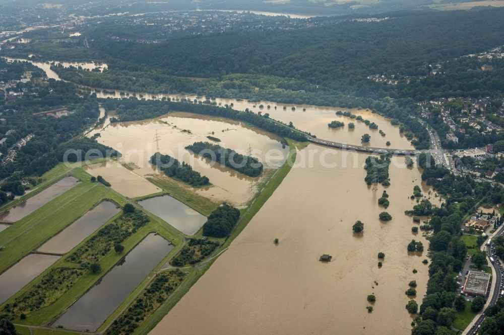 Essen from above - Flood situation and flooding, all-rousing and infrastructure-destroying masses of brown water on the course of the river Ruhr in the district Ueberruhr - Hinsel in Essen at Ruhrgebiet in the state North Rhine-Westphalia, Germany