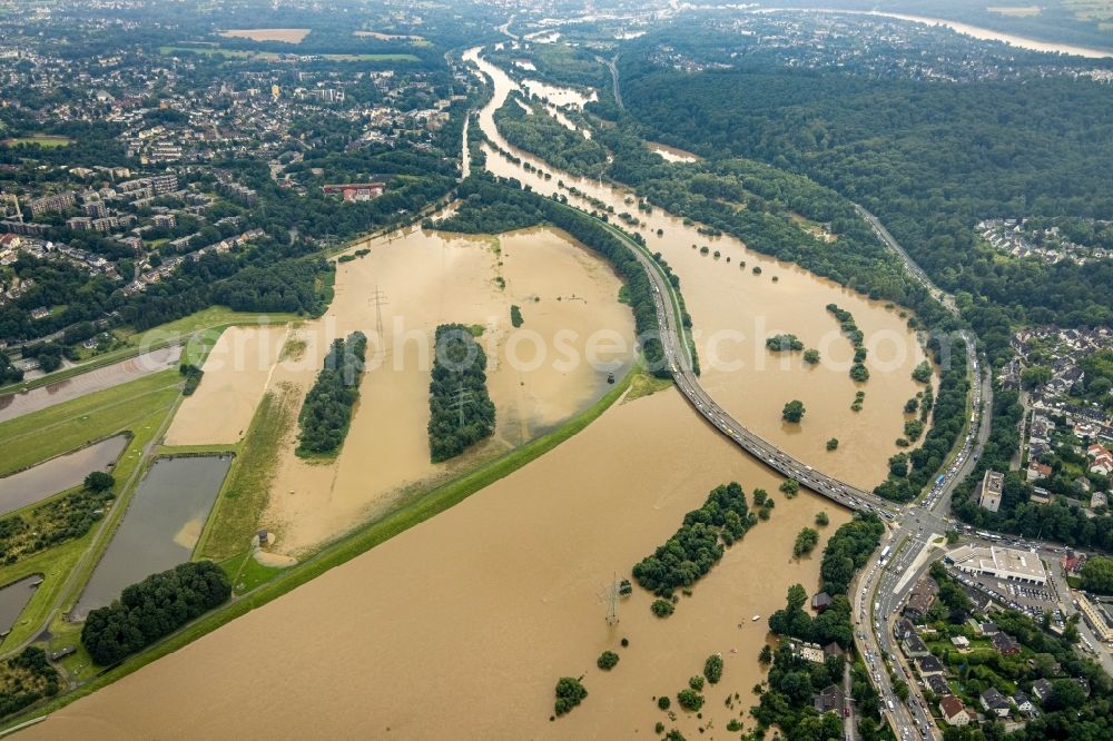 Aerial image Essen - Flood situation and flooding, all-rousing and infrastructure-destroying masses of brown water on the course of the river Ruhr in the district Ueberruhr - Hinsel in Essen at Ruhrgebiet in the state North Rhine-Westphalia, Germany