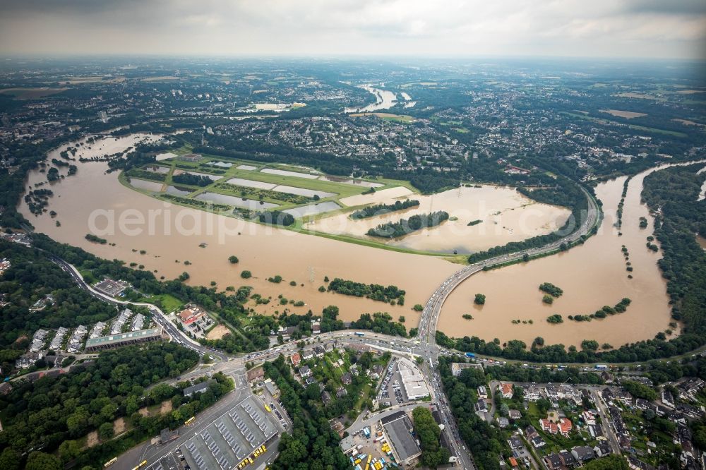 Aerial photograph Essen - Flood situation and flooding, all-rousing and infrastructure-destroying masses of brown water on the course of the river Ruhr in the district Ueberruhr - Hinsel in Essen at Ruhrgebiet in the state North Rhine-Westphalia, Germany