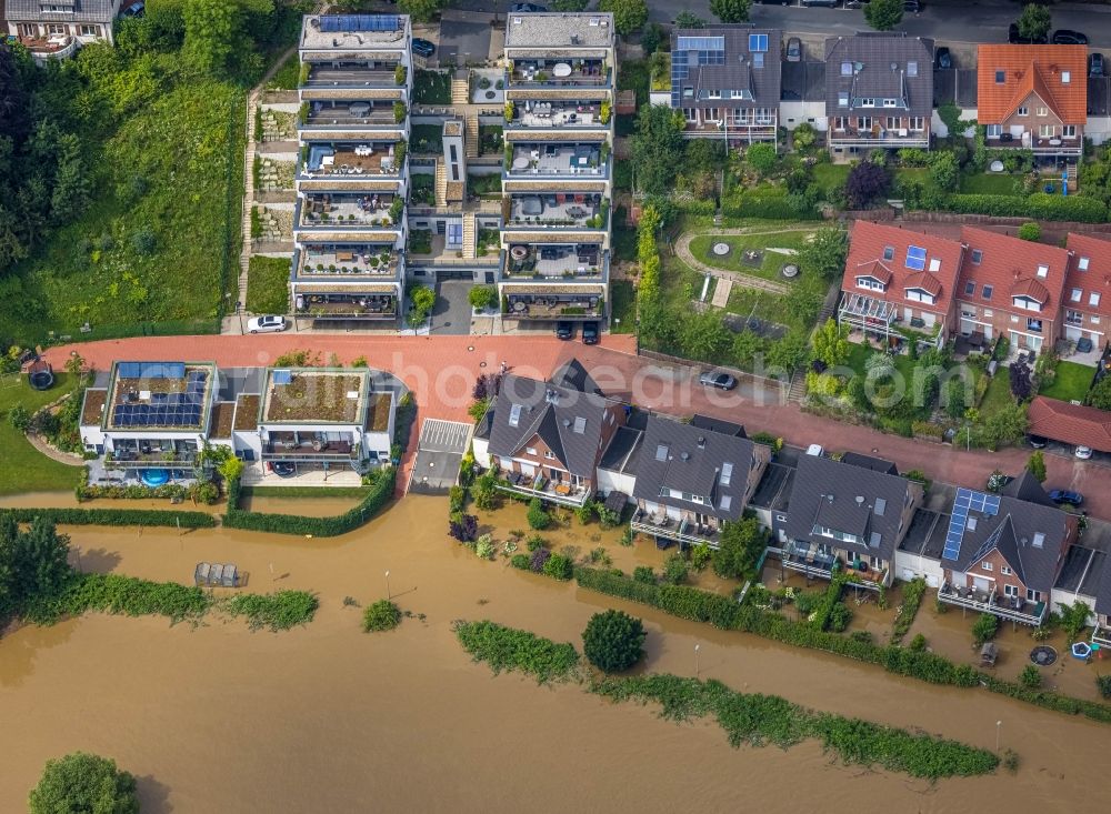 Hattingen from above - Flood situation and flooding, all-rousing and infrastructure-destroying masses of brown water on the course of the river Ruhr in Hattingen at Ruhrgebiet in the state North Rhine-Westphalia, Germany