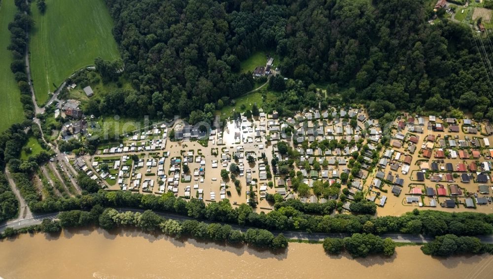 Hattingen from the bird's eye view: Flood situation and flooding, all-rousing and infrastructure-destroying masses of brown water on the course of the river Ruhr in Hattingen at Ruhrgebiet in the state North Rhine-Westphalia, Germany