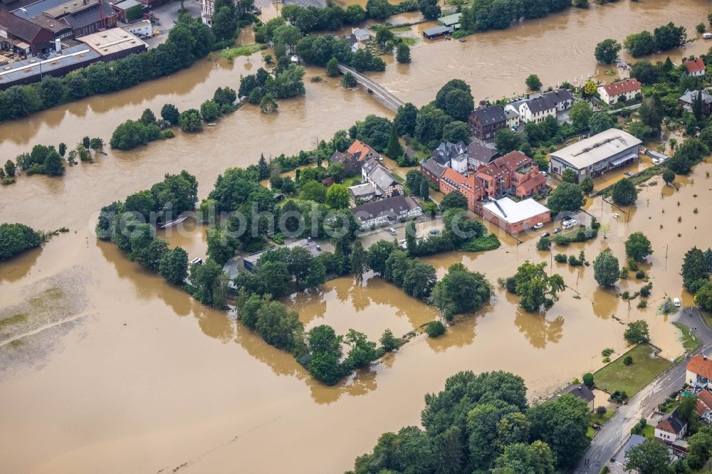 Aerial photograph Witten - Flood situation and flooding, all-rousing and infrastructure-destroying masses of brown water on the course of the river Ruhr In der Lake in Witten at Ruhrgebiet in the state North Rhine-Westphalia, Germany