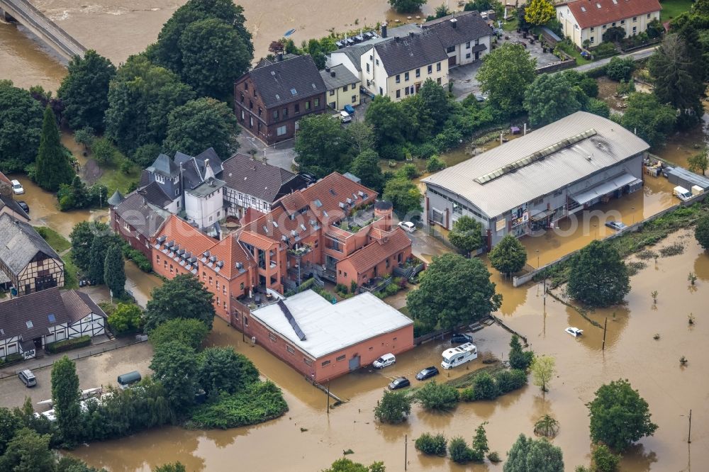 Witten from above - Flood situation and flooding, all-rousing and infrastructure-destroying masses of brown water on the course of the river Ruhr In der Lake in Witten at Ruhrgebiet in the state North Rhine-Westphalia, Germany