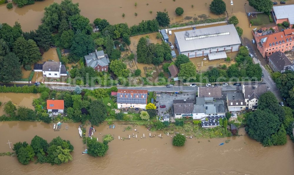 Witten from above - Flood situation and flooding, all-rousing and infrastructure-destroying masses of brown water on the course of the river Ruhr In der Lake in Witten at Ruhrgebiet in the state North Rhine-Westphalia, Germany